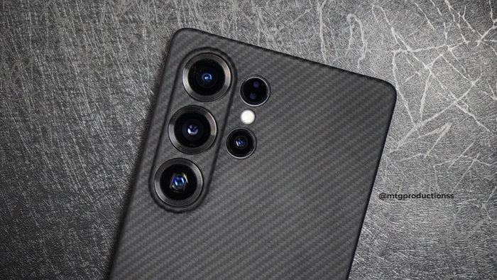 Samsung Galaxy S25 Ultra with black woven texture slim aramid fiber case in dark background